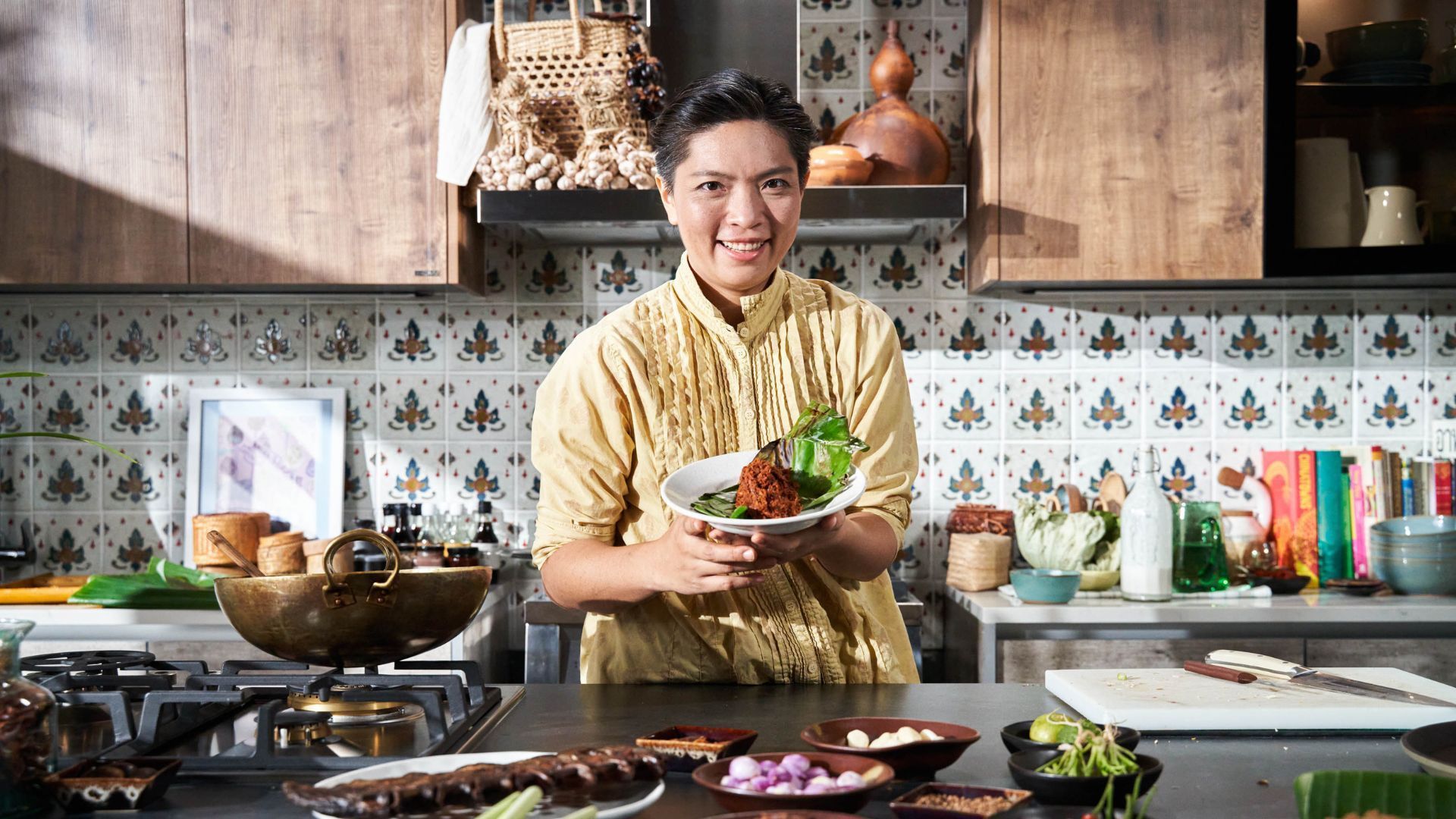 Michelin chef with Thai dish in a kitchen